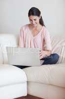 Portrait of a woman using a notebook