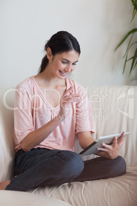 Portrait of a young woman using a tablet computer