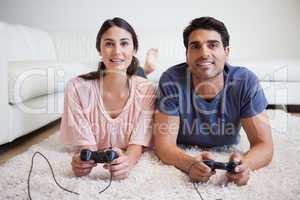 Young couple playing video games