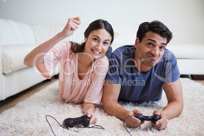 Woman beating her boyfriend while playing video games