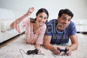 Woman beating her boyfriend while playing video games