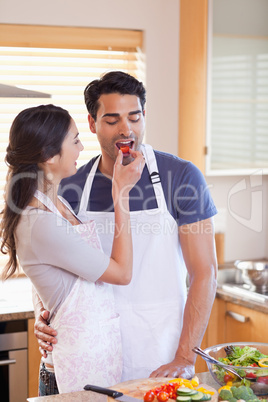 Portrait a woman feeding her husband