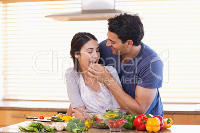 Man feeding his wife