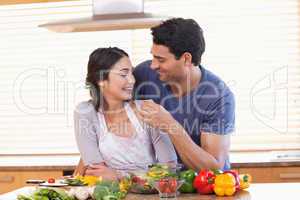 Man feeding his girlfriend