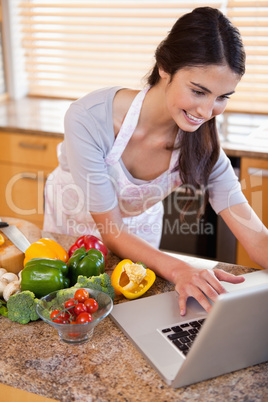 Portrait of a woman looking for a recipe on the internet