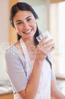 Portrait of a beautiful woman drinking milk