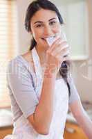 Portrait of a gorgeous woman drinking milk