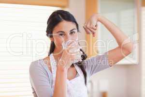 Healthy woman drinking milk