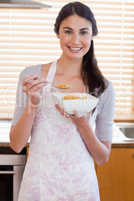 Portrait of a woman eating cereal