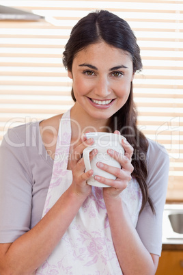 Portrait of a woman holding a cup of tea