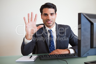 Businessman showing his hand