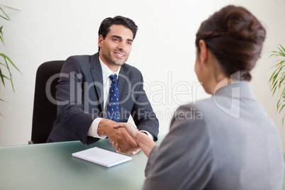 Smiling manager interviewing a female applicant