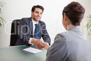 Smiling manager interviewing a female applicant