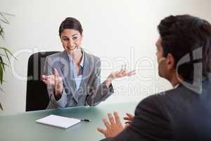Smiling manager interviewing an employee