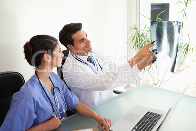 Doctors looking at a set of X-ray