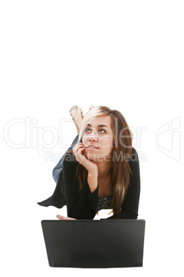 Girl with laptop on floor thinking about something