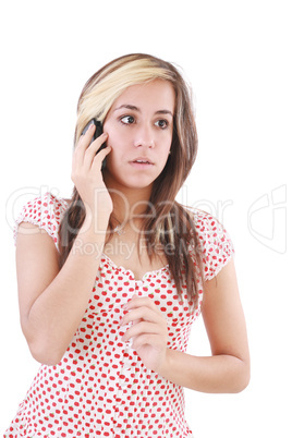 Portrait of shocked woman talking on phone call over white backg