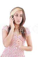 Portrait of shocked woman talking on phone call over white backg