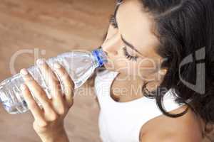 Latina Hispanic Woman Girl Drinking Water Bottle at Gym