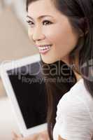 Beautiful Asian Woman Using Tablet Computer