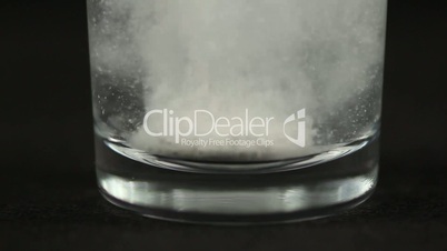 Fizzy tablet gets dissolved in a glass of water