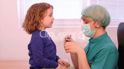 female doctor gives a little girl a cure