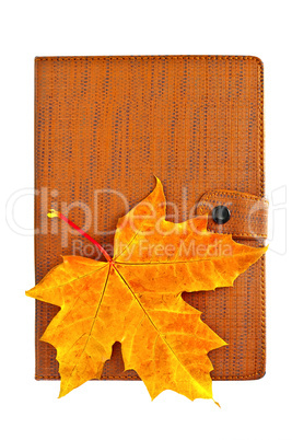 Notebook closed with a maple leaf