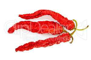 Three pods of dried hot peppers
