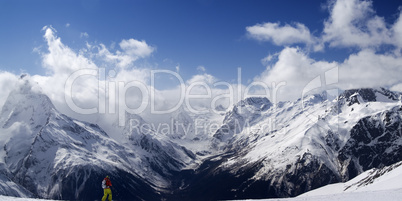 Panorama Caucasus Mountains. Slope with skier.