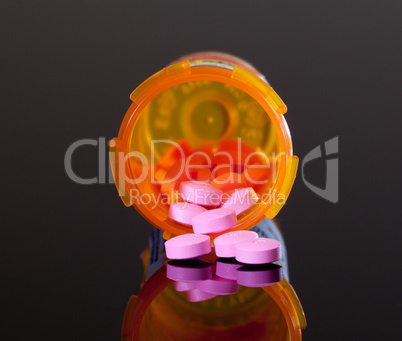 Purple pills from orange drug bottle