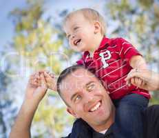 Young Laughing Father and Child Piggy Back