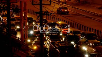 Many cars on overpass,traffic jam at night.