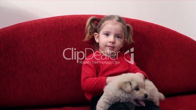 little girl with puppy pet