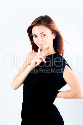 Woman making a keep it quiet gesture