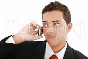Close-up of attractive young businessman on cellphone. Nineteen