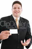 young attractive businessman shows his business card, focus in m