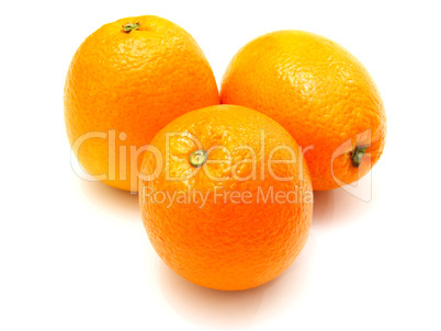 Three ripe oranges lie nearby on a white background