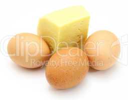cheese and eggs, isolated on white.