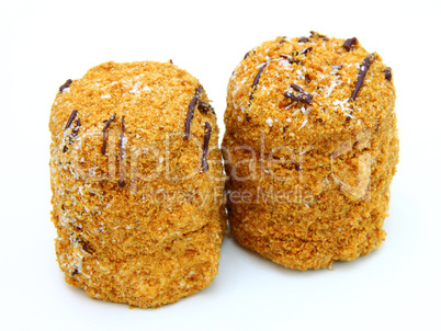 Honey cake with chocolate on a white background