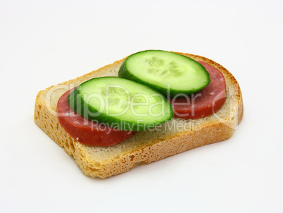 sandwich with sausage and a cucumber