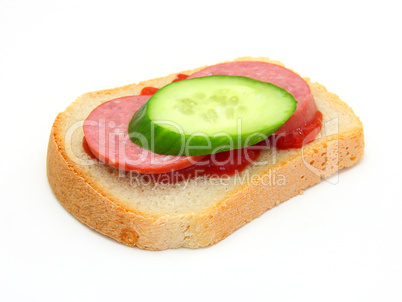 sandwich with Ketchup sausage and a cucumber