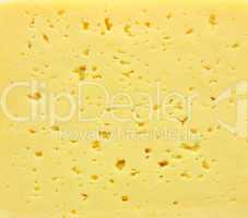 Background of fresh yellow Swiss cheese with holes