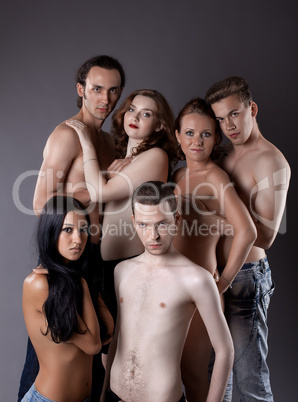 group of sexy young nude people posing in jeans