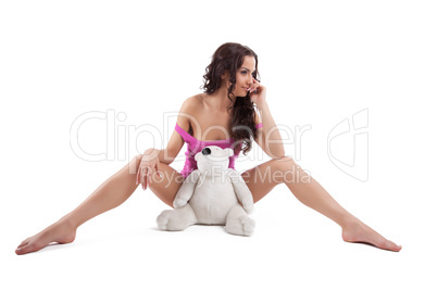 Young sexy woman in purple shirt with white bear