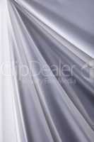 white silk cloth waves background texture close-up