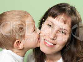 Child kissing mother