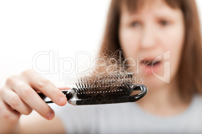 Loss hair comb in women hand