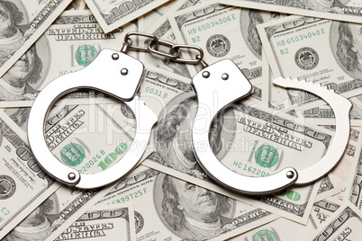 Handcuffs on dollar currency