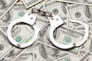 Handcuffs on dollar currency