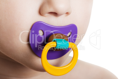 Child with baby pacifier